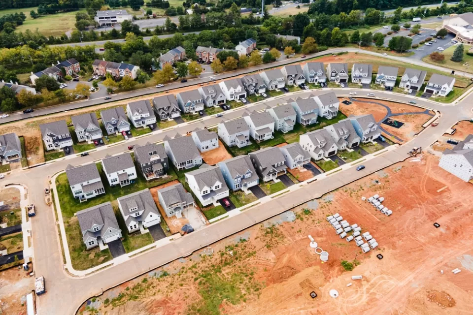 Aerial view of dense single-family homes in neighborhood still under construction
